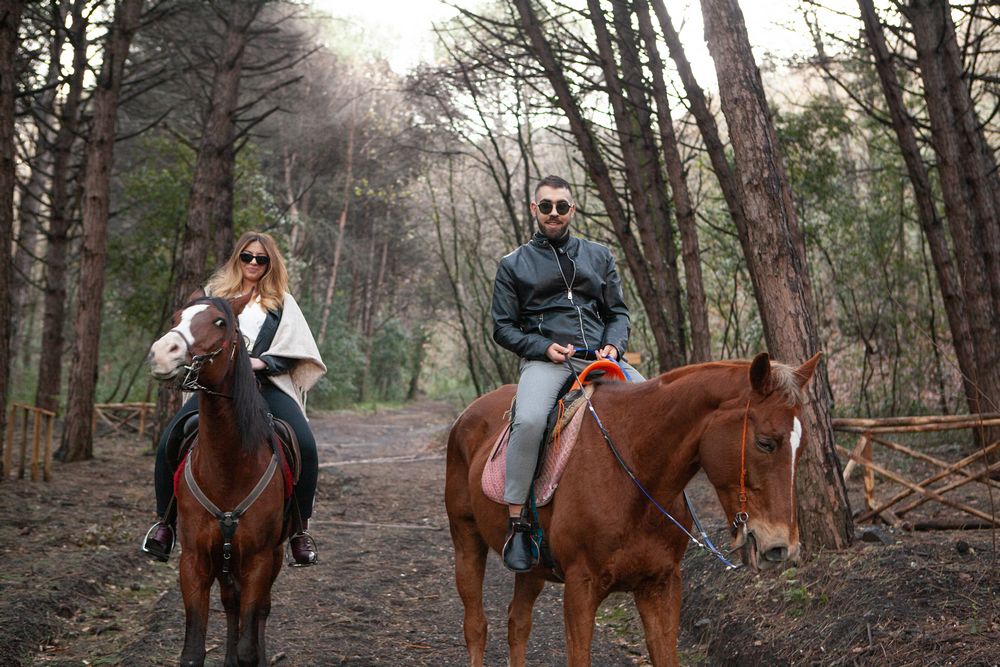 Couple riding a horse in the Vesuvius National Park