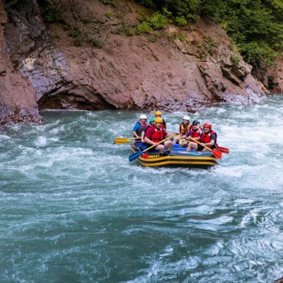 Group of turists rafting on the river, extreme and fun sport at tourist attraction natural park Campania